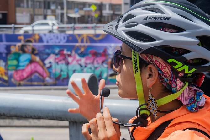 Bogotá Bike Tour with street art - Stop 1 in La Candelaria: Colonial Streets, Chorro de Quevedo, and Real Context