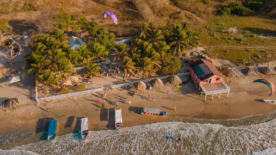 Eco-Luxury Beach Escape at Pink Mango, Tierra Bomba - The Beach Club Setup: Beds, Hammocks, Pool Time, and Games