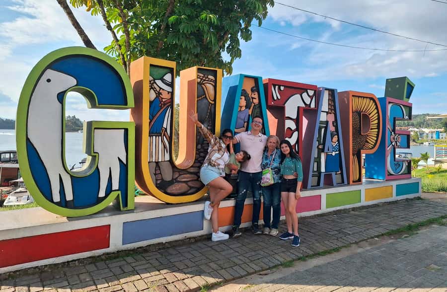 From Medellin: Guatapé & Peñol Rock with Boat & farm animals - Guatapé town time: Umbrella Street and the story in the baseboards