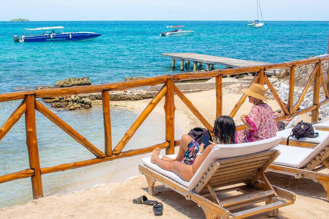 Full day visiting 5 stops 3 Beach Clubs (Rosario, Baru,T Bomba) - Tierra Bomba finale: private beach club views, pool time, and possible DJs