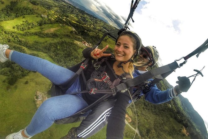 Guatape & Paragliding & El Peñol Rock & Quaint Town From Medellin - Paragliding first: included equipment, pilot-led safety, and the 15-minute thrill