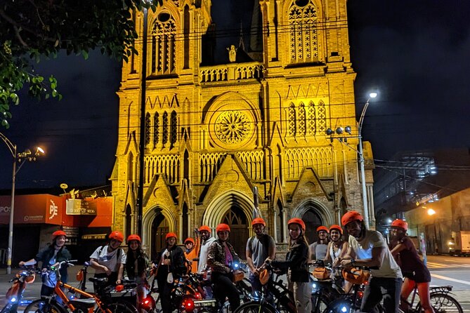 Medellín Christmas Lights E-Bike Tour with Snack & Donation - Belén Fátima illuminated houses and the message pause