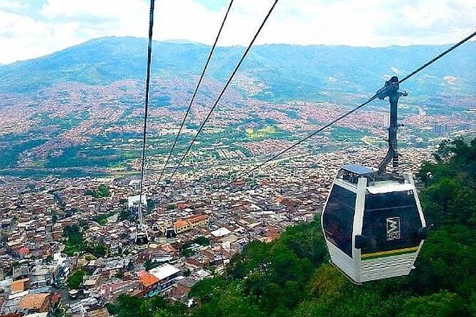 Medellín Comuna 13 Tour Graffiti Culture and Cable Car Ride - Stop 3: Comuna 13 viewpoints, tourism impact, and a real snack