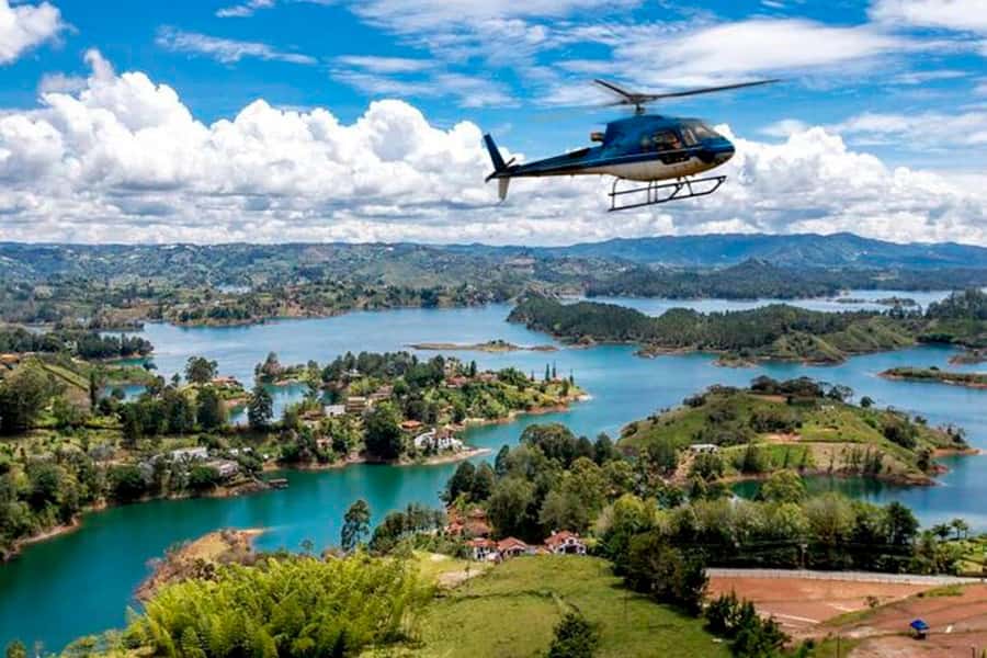 Medellín: Guatapé Private Tour with Helicopter & Boat Ride - Guatapé town and zócalos: easy strolling, big color payoff