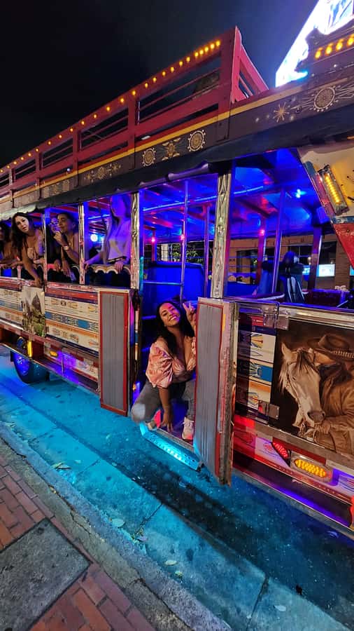 Medellin: Party Bus with DJ & Street Food Tastings - Meeting in El Poblado: Where to Go and What to Bring