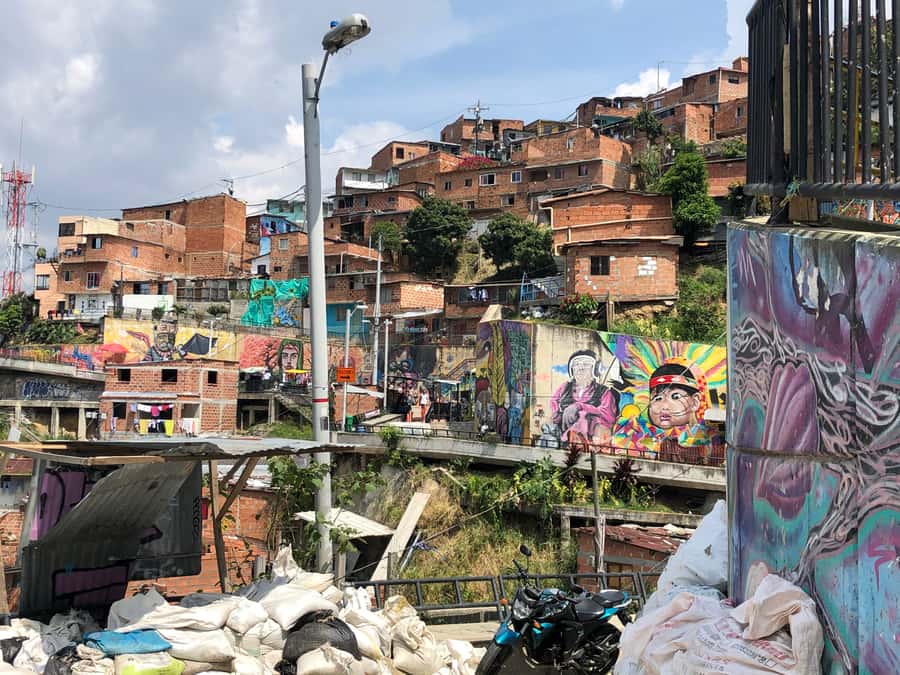 Medellín: Private Comuna 13 Street Art Tour - Comuna 13 on Foot: Murals, Escalators, and Personal Stories