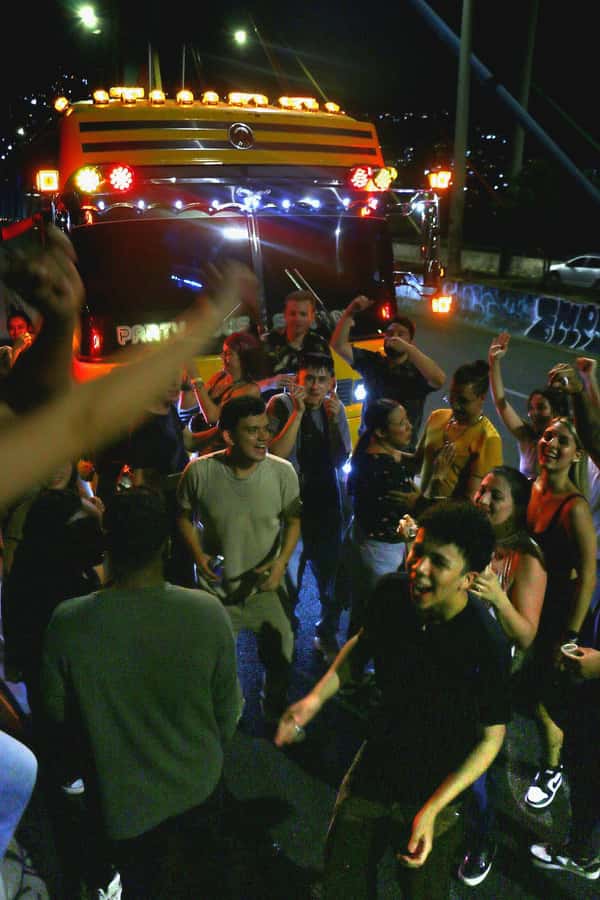 Medellin: Rumbero Party Bus with all the beer you can drink - Guide energy matters: Eugene, Isa, and yuda in the vibe