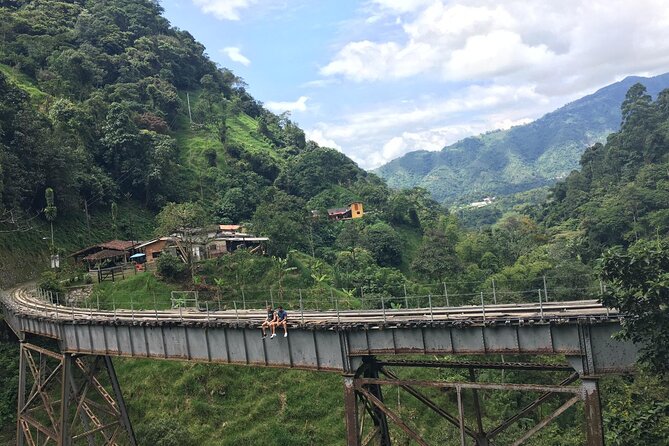 Mountain Bike Tour with Coffee and Lunch in Antioquia's Beautiful Landscapes - Riding a former coffee railroad outside Medellín