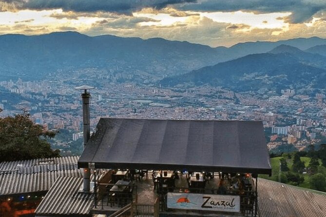 Private Half-Day Food Tour Visiting Best Viewpoints in Medellín! - The Eight Wonder Bar: empanadas with the night skyline
