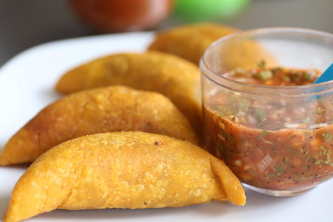Private Street Food Tour, Eat like a Local in Medellin! - Plaza Botero: where the tour turns from eating to supporting local producers
