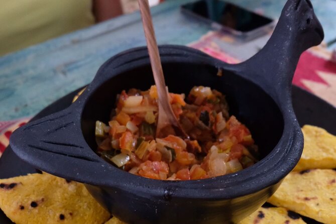 Sabor Colombiano Cooking Studio - Grinding corn and making arepas from scratch