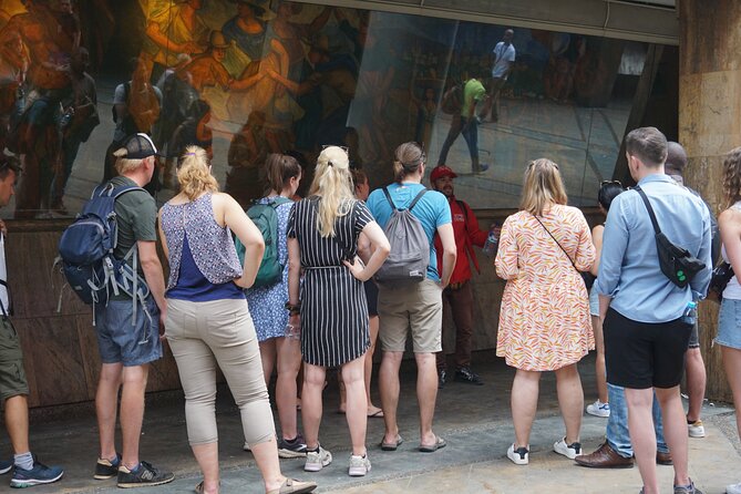 Shared Tour Historic Center of Medellin with Audio System - Pedro Nel Gómez mural at the Berrio Metro Station walkway