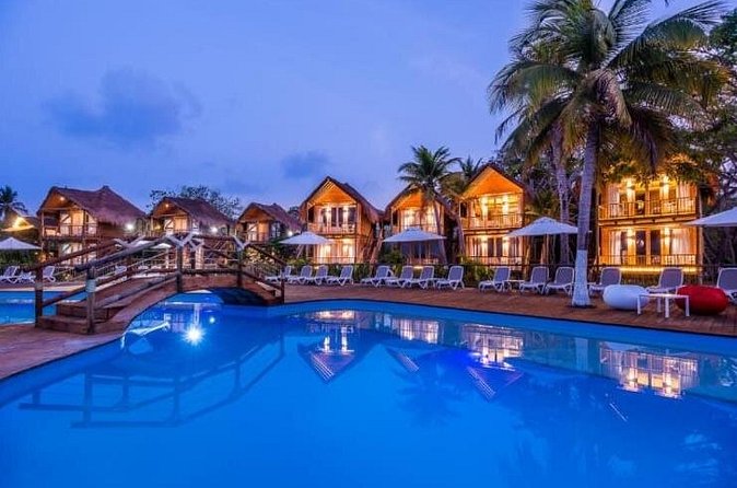Tour Isla del Encanto Cartagena - Landing on the private island: chairs, pools, and beach time